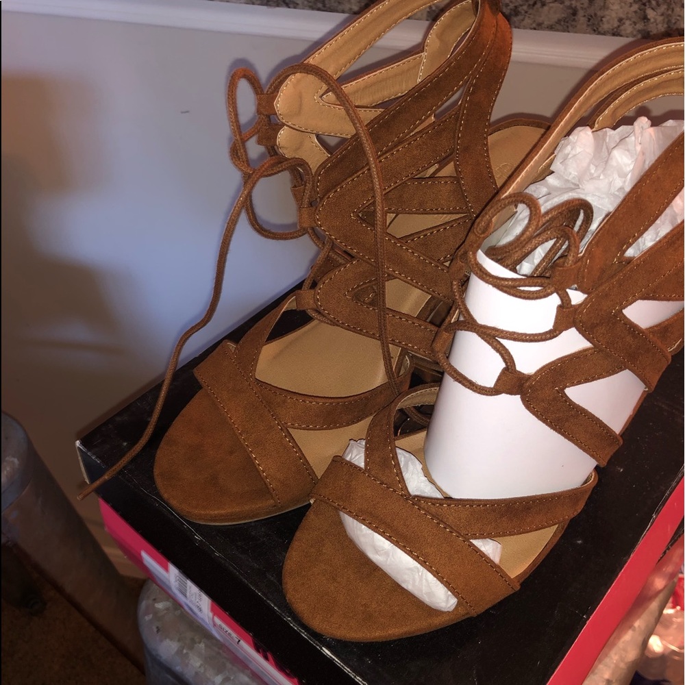 Brown suede sandal with heel and tie up ankle.